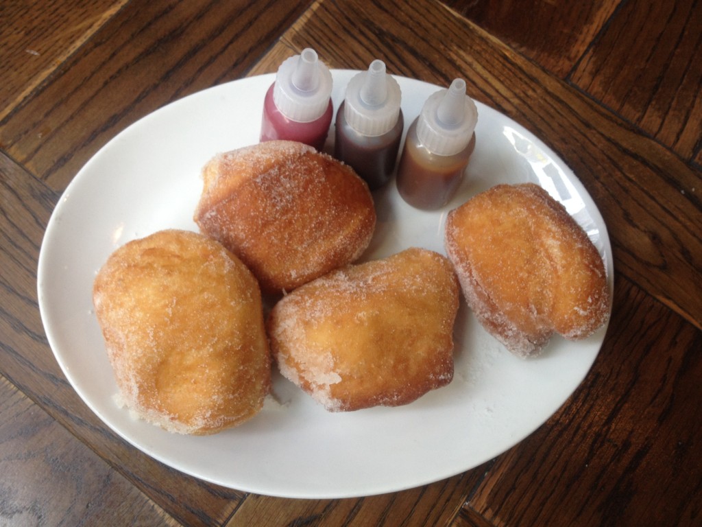 Only the most amazing dessert ever: beignets with raspberry, chocolate hazelnut and caramel whiskey sauces.